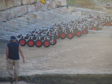 Trolleys stacked on the beach